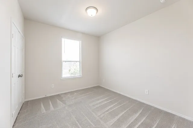a white bath tub sitting next to a toilet