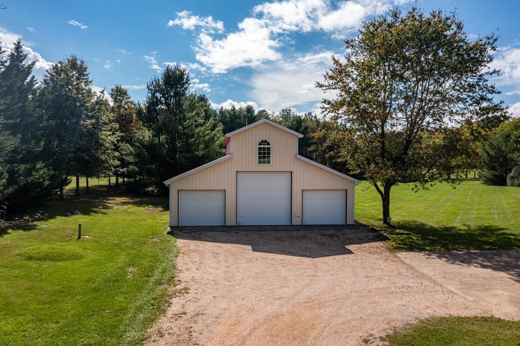 1275 Ladd Road Waynesboro, VA 22980 - Photo 13 of 75 a front view of a house with a yard and garage