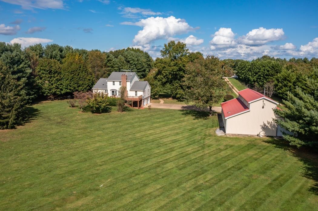 1275 Ladd Road Waynesboro, VA 22980 - Photo 16 of 75 a backyard of a house with lots of green space and outdoor seating