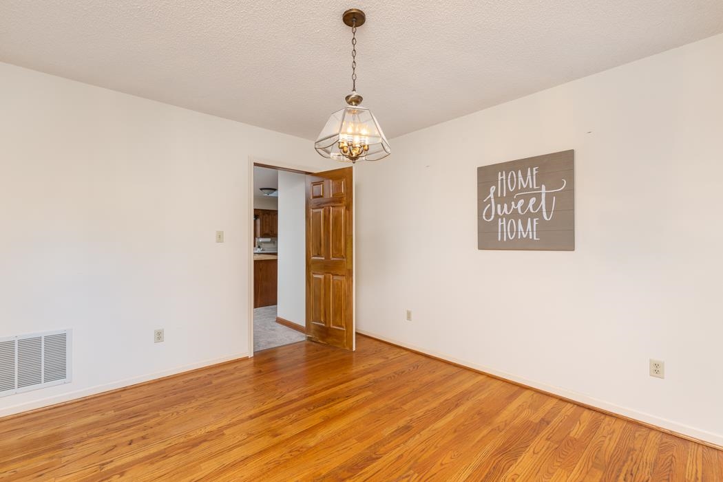 1275 Ladd Road Waynesboro, VA 22980 - Photo 30 of 75 a view of an empty room with wooden floor and a window