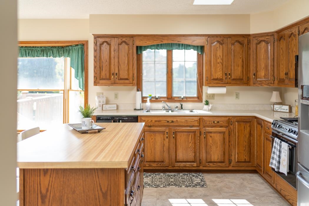 1275 Ladd Road Waynesboro, VA 22980 - Photo 38 of 75 a kitchen with stainless steel appliances a stove a sink and a refrigerator