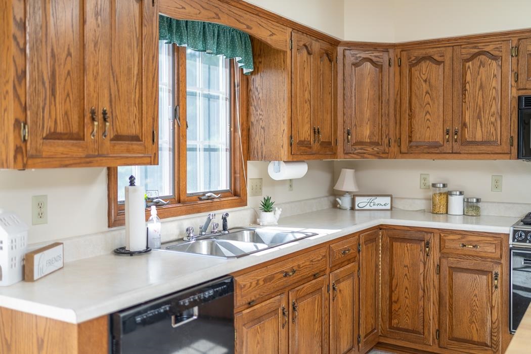 1275 Ladd Road Waynesboro, VA 22980 - Photo 40 of 75 a kitchen with stainless steel appliances granite countertop a sink a stove and a cabinets
