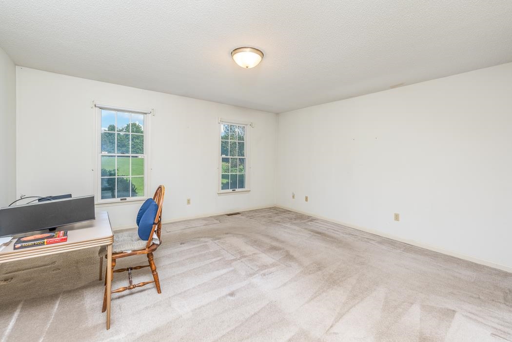 1275 Ladd Road Waynesboro, VA 22980 - Photo 50 of 75 a living room with furniture and a window