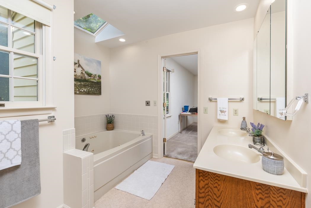 1275 Ladd Road Waynesboro, VA 22980 - Photo 52 of 75 a bathroom with a tub sink and mirror