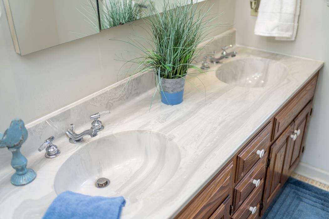 1275 Ladd Road Waynesboro, VA 22980 - Photo 65 of 75 a bathroom with a sink a faucet and a mirror