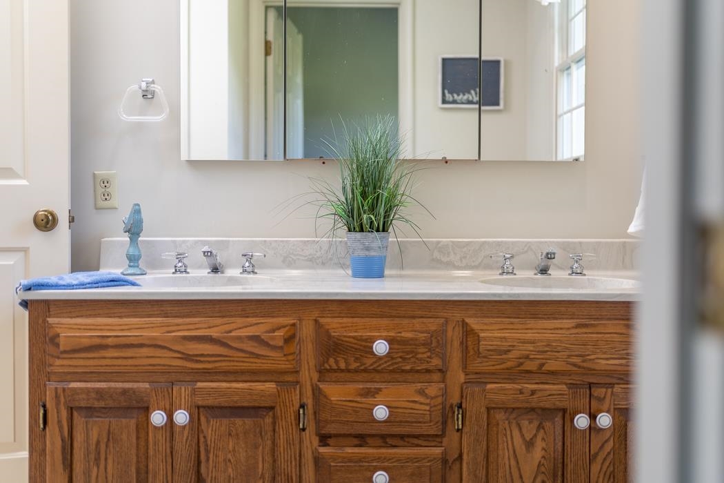 1275 Ladd Road Waynesboro, VA 22980 - Photo 66 of 75 a bathroom with a sink and a mirror