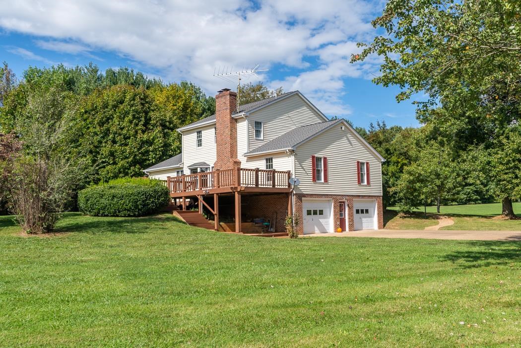 1275 Ladd Road Waynesboro, VA 22980 - Photo 10 of 75 a view of a house with a big yard and large trees