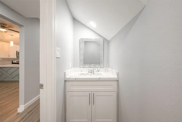 a bathroom with a sink and a mirror
