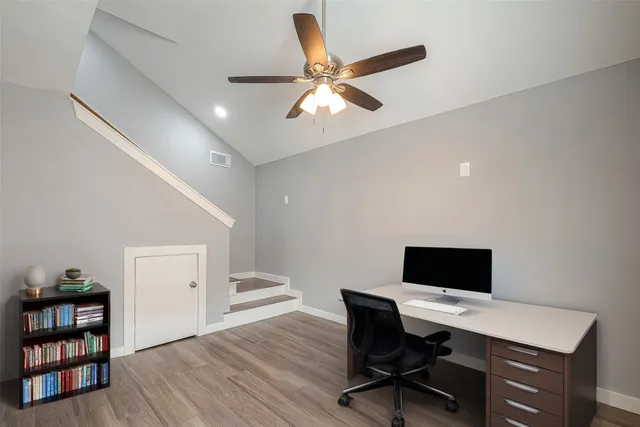 a workspace with furniture and wooden floor