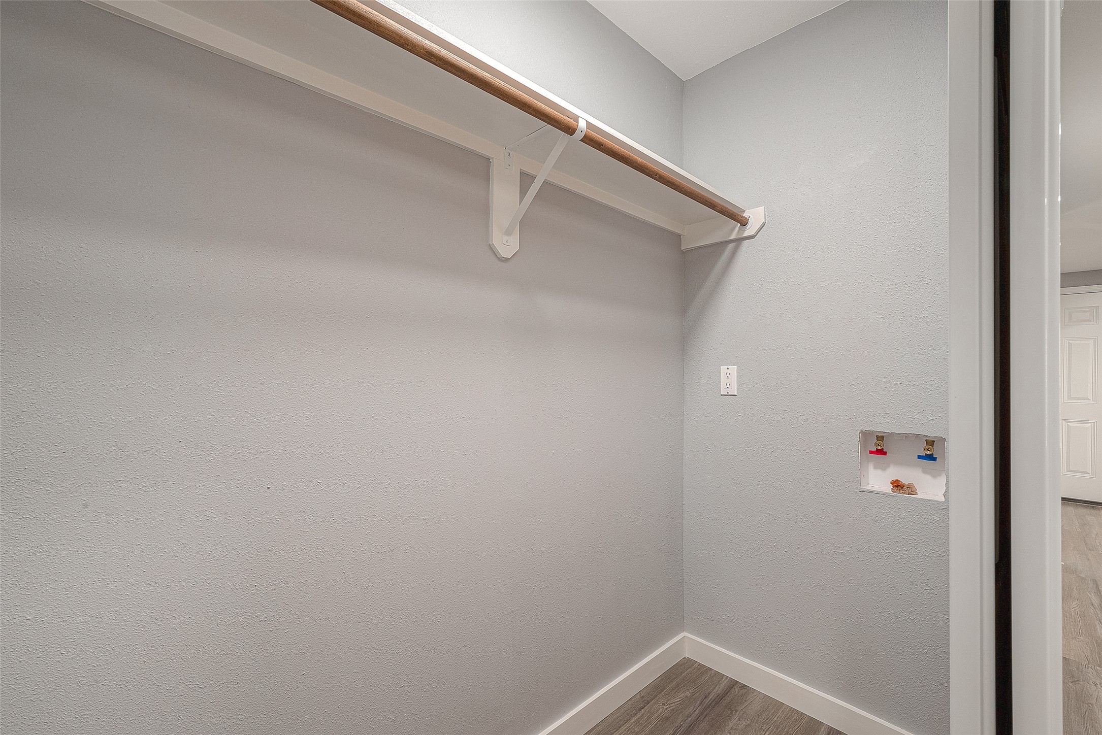 2725 Avenue F, Unit RR Rosenberg, TX 77471 - Photo 22 of 23 a view of a rack on the wall