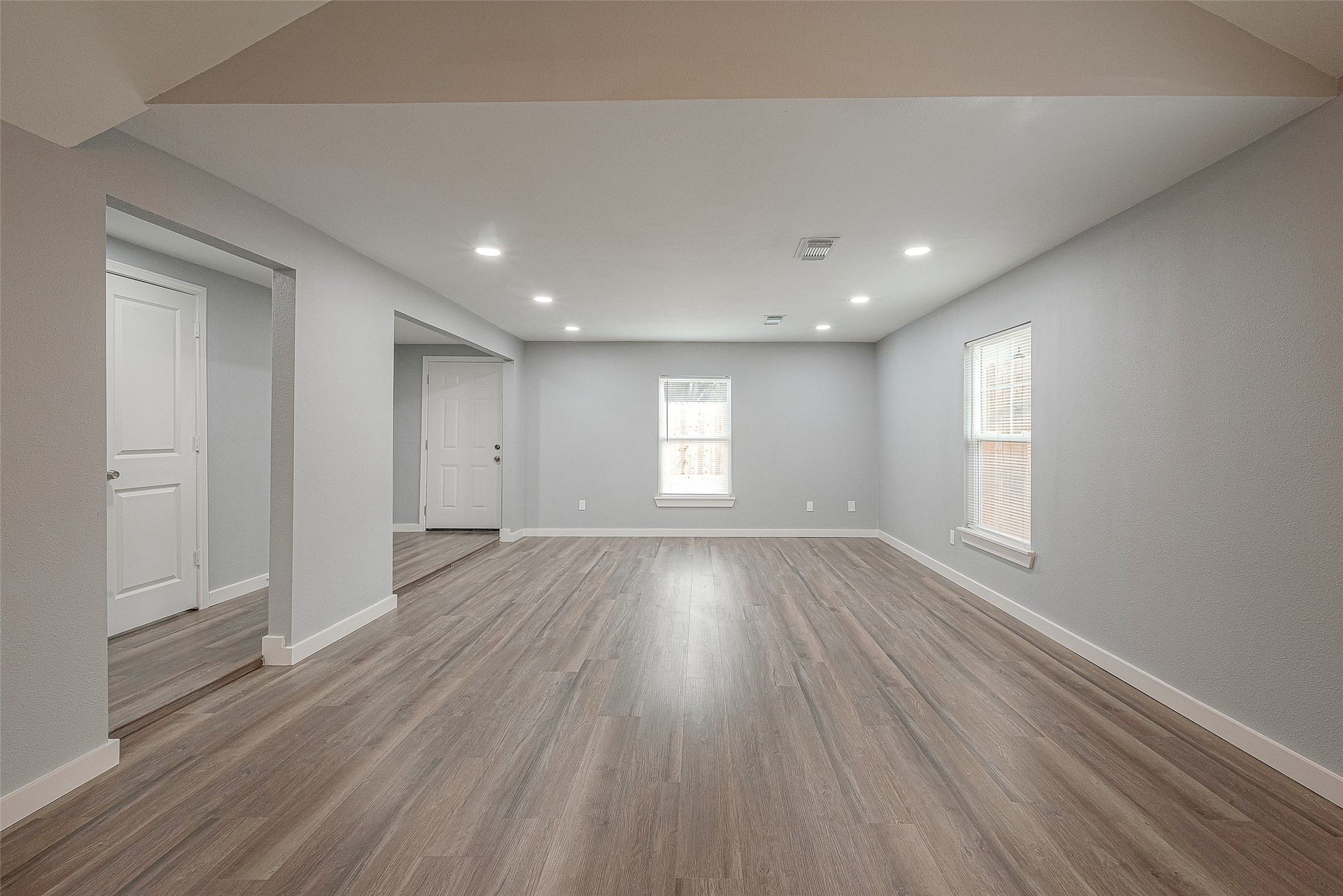 2725 Avenue F, Unit RR Rosenberg, TX 77471 - Photo 8 of 23 a view of empty room with window and wooden floor