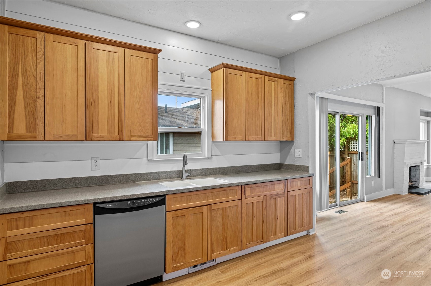 3015 21st Street Everett, WA 98201 - Photo 11 of 26 a kitchen with stainless steel appliances granite countertop wooden cabinets a sink and dishwasher