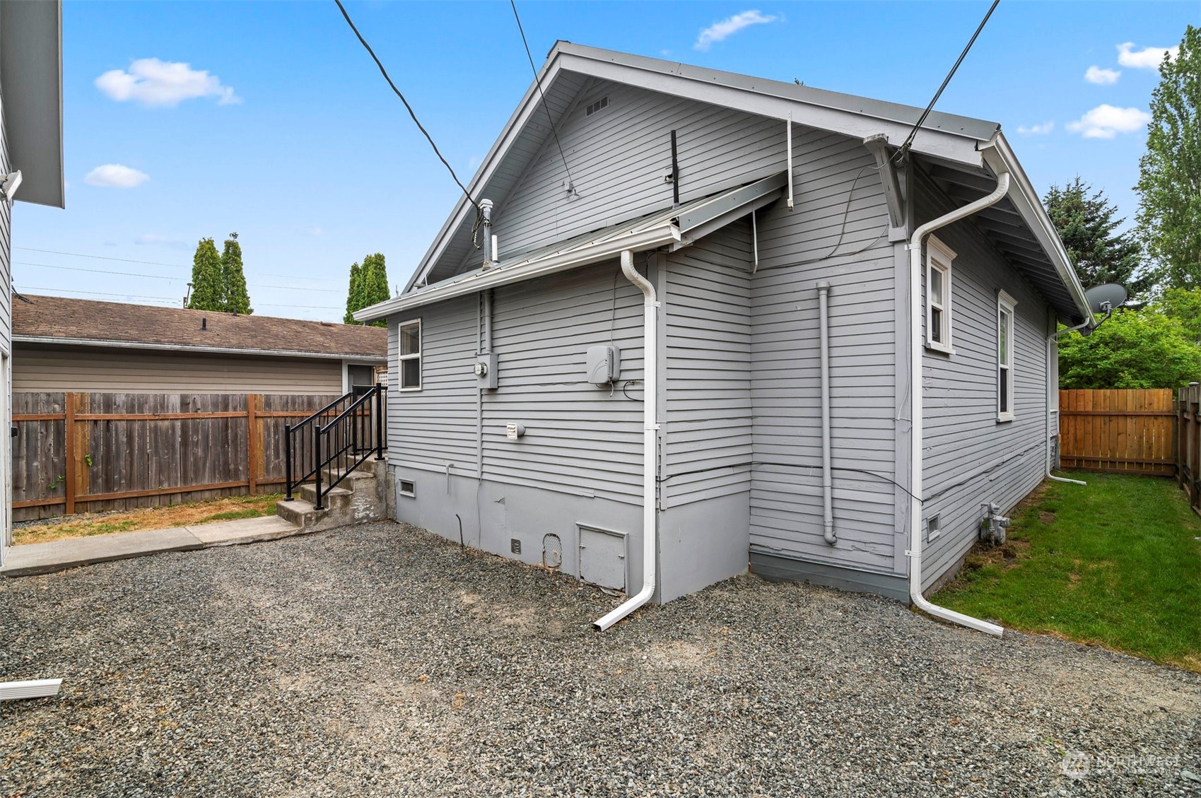 3015 21st Street Everett, WA 98201 - Photo 15 of 26 a view of a house with a yard and garage