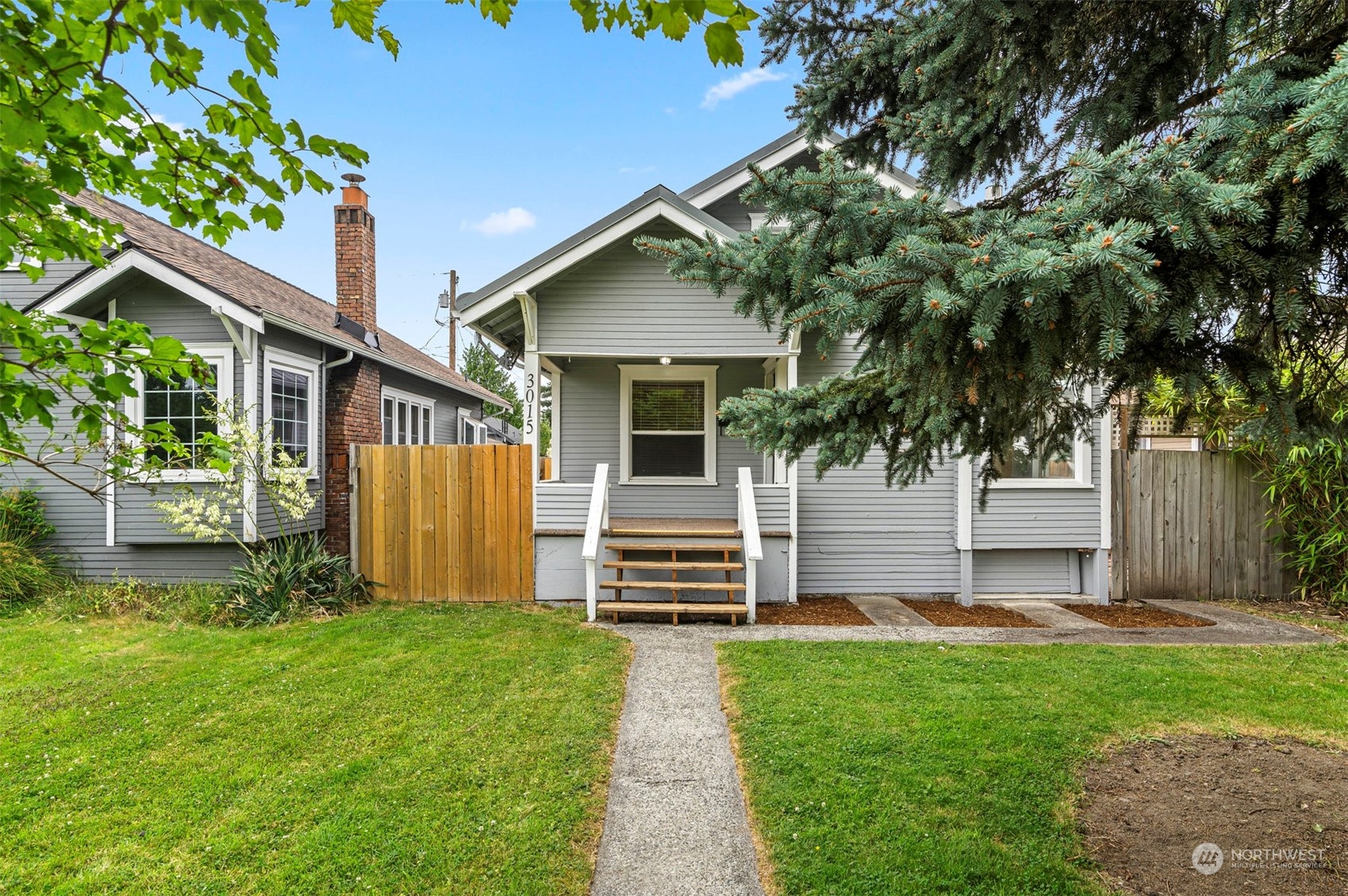 3015 21st Street Everett, WA 98201 - Photo 2 of 26 a front view of a house with garden