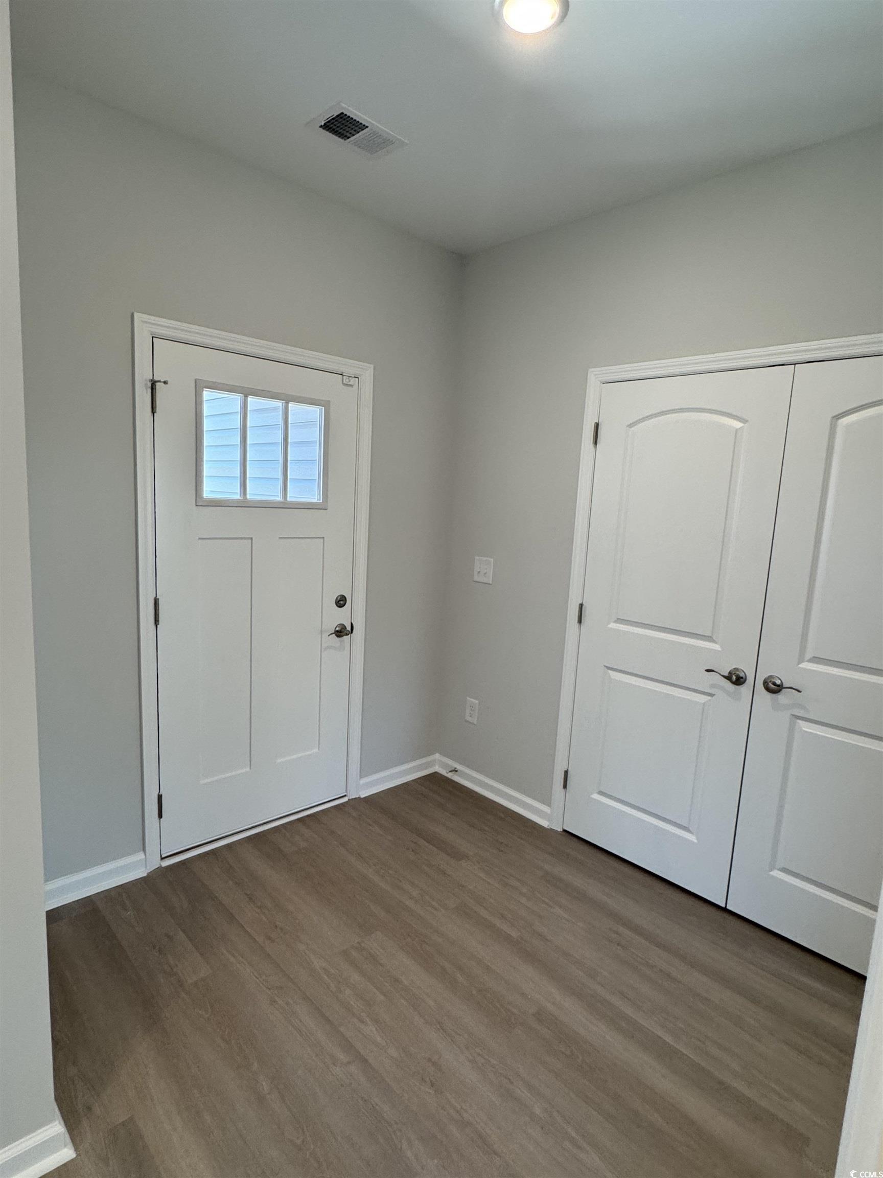 598 Shallow Cv Drive Conway, SC 29527 - Photo 11 of 25 Foyer entrance with wood finished floors and baseb