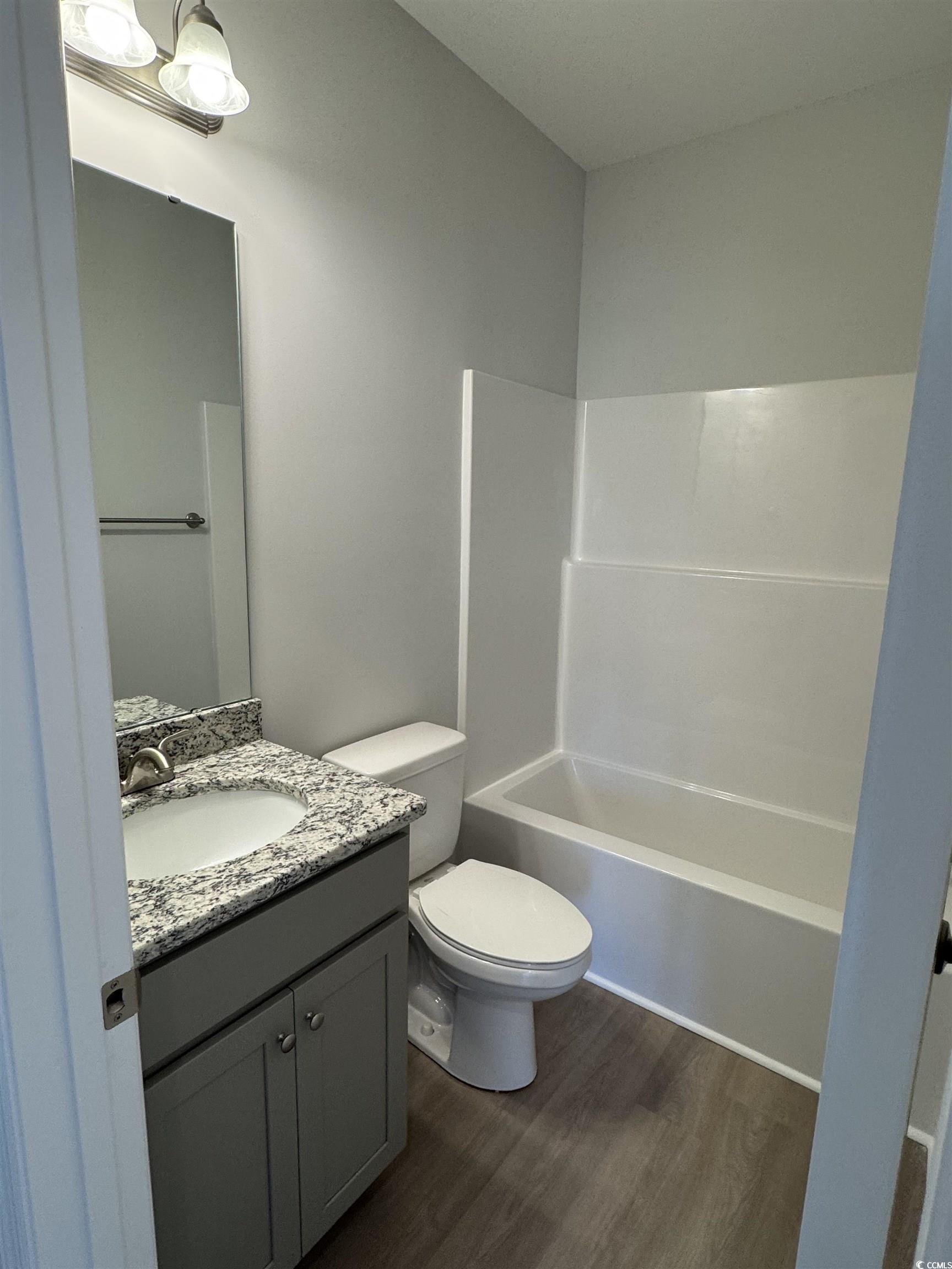 598 Shallow Cv Drive Conway, SC 29527 - Photo 15 of 25 Bathroom with dark wood-type flooring, vanity, and