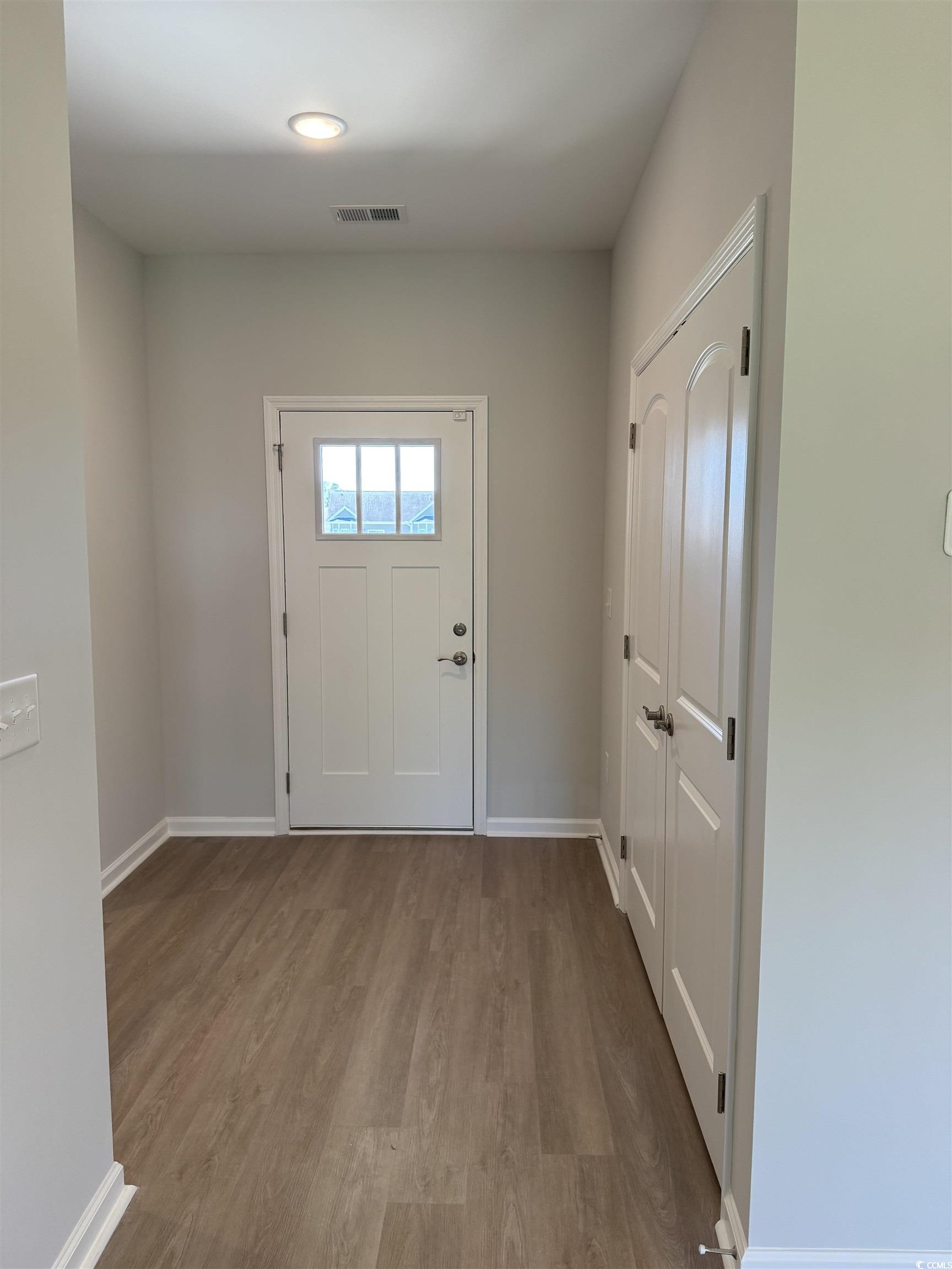 598 Shallow Cv Drive Conway, SC 29527 - Photo 17 of 25 Doorway to outside with wood finished floors and b