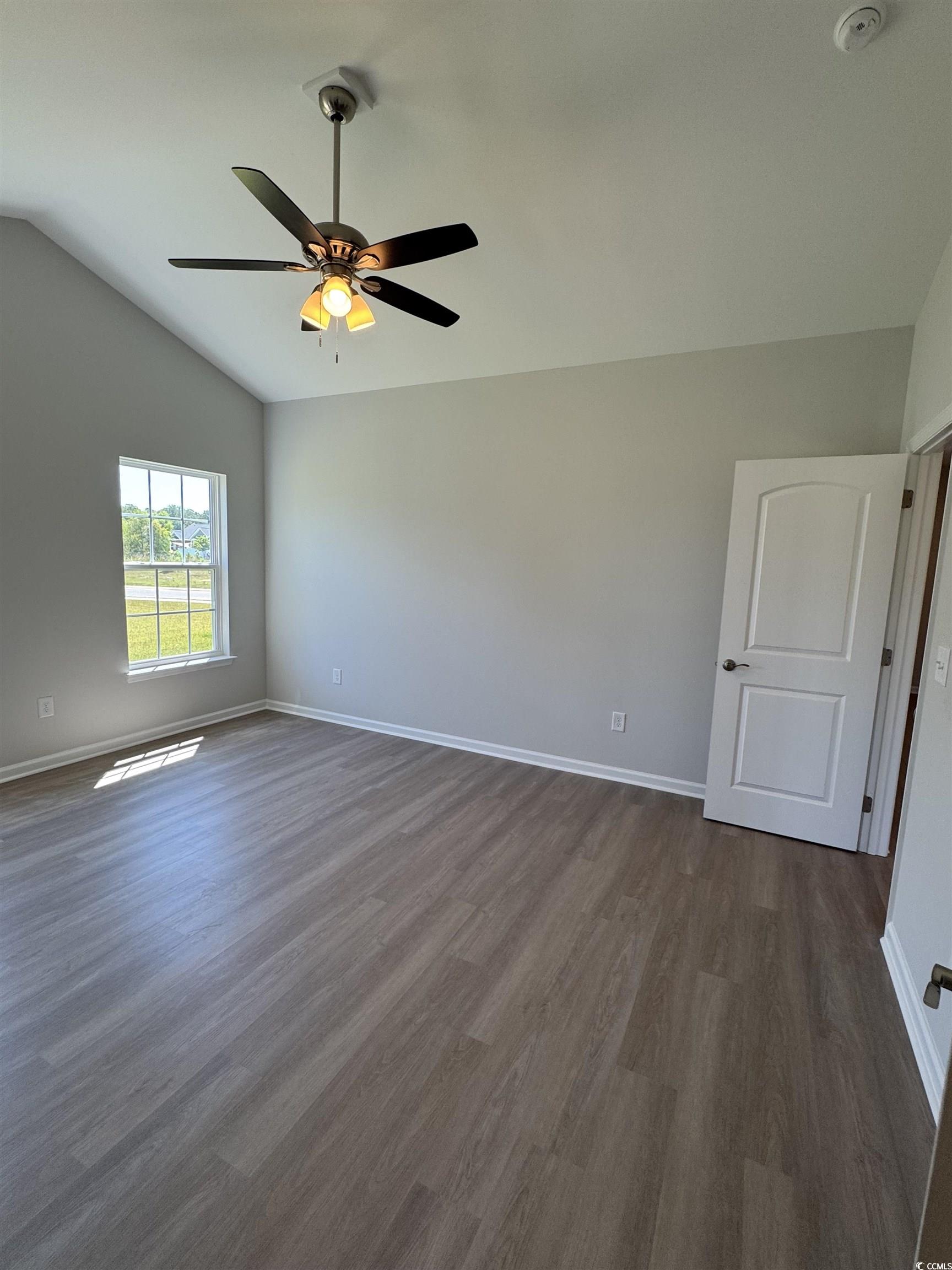 598 Shallow Cv Drive Conway, SC 29527 - Photo 19 of 25 Unfurnished room featuring vaulted ceiling, dark w