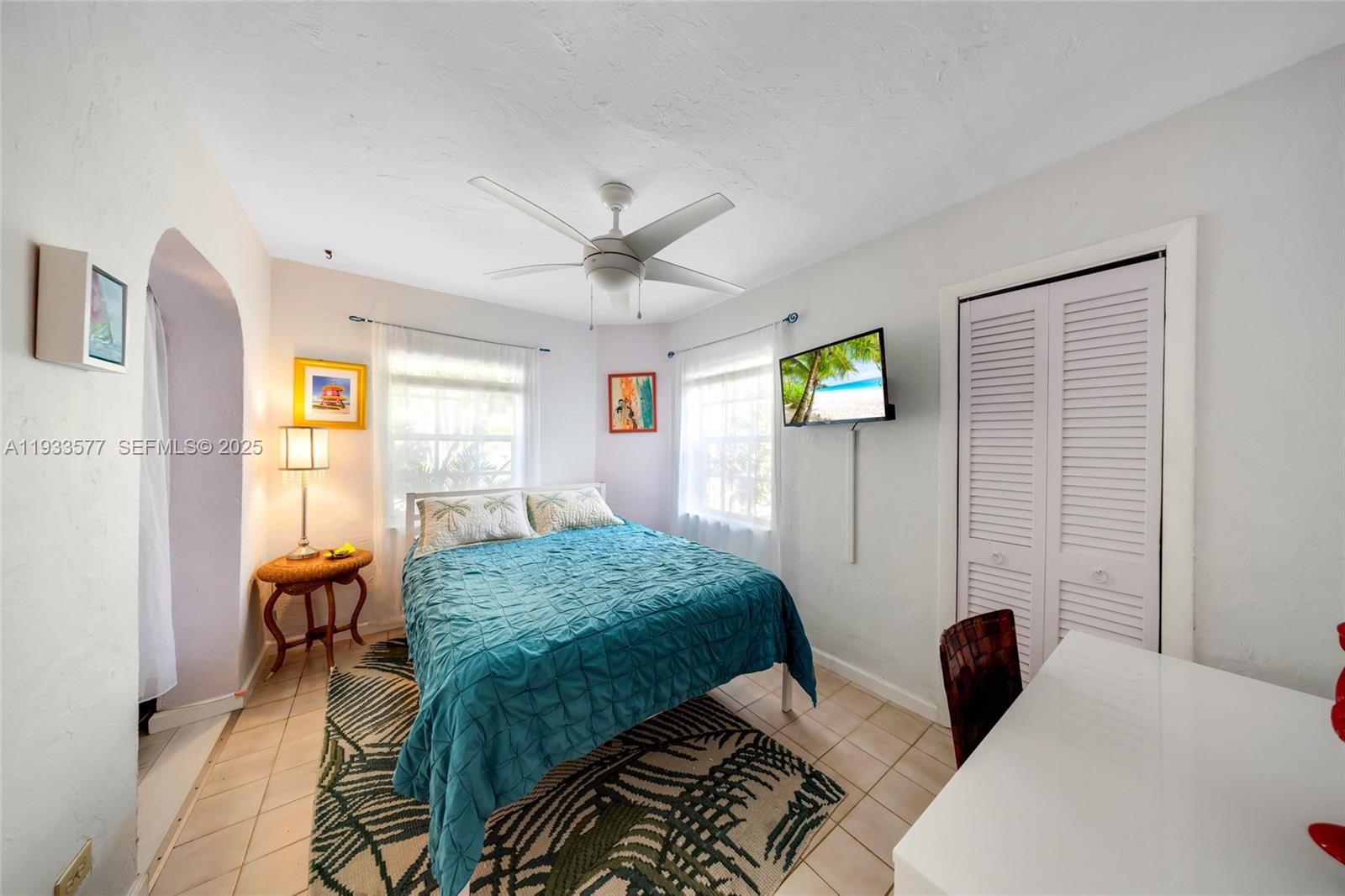 1840 Tigertail Avenue Miami, FL 33133 - Photo 13 of 32 a bedroom with 2 bed and a window