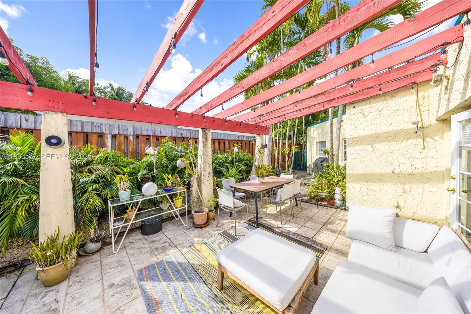 1840 Tigertail Avenue Miami, FL 33133 - Photo 18 of 32 a building outdoor space with patio furniture and potted plants