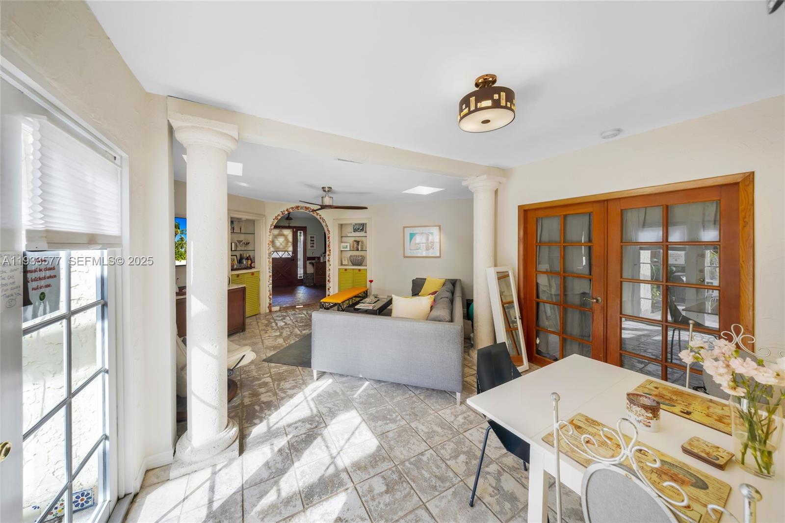 1840 Tigertail Avenue Miami, FL 33133 - Photo 2 of 32 a view of a living room and a chandelier