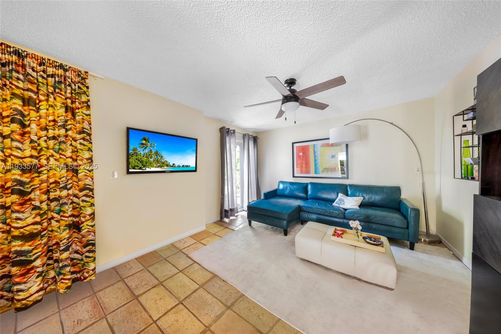 1840 Tigertail Avenue Miami, FL 33133 - Photo 27 of 32 a living room with furniture and a window