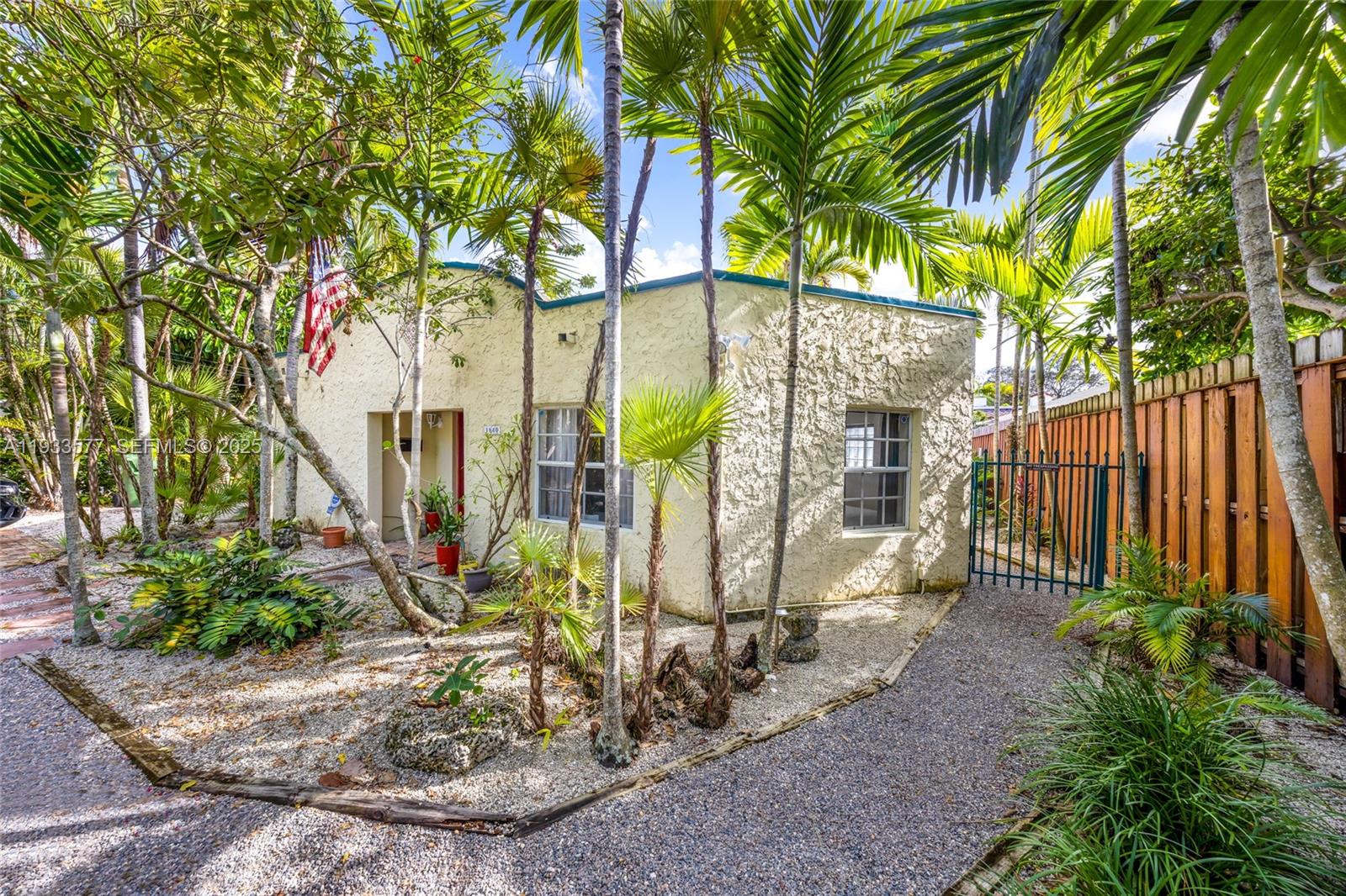 1840 Tigertail Avenue Miami, FL 33133 - Photo 30 of 32 a view of a small garden area with swimming pool