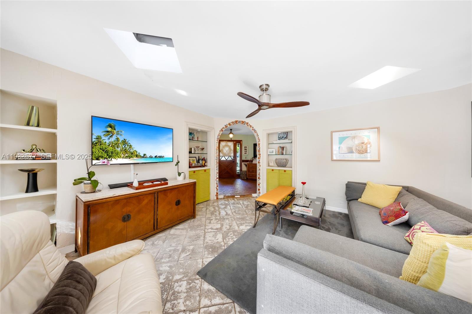 1840 Tigertail Avenue Miami, FL 33133 - Photo 4 of 32 a living room with furniture and a kitchen