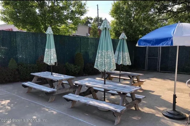 a view of backyard with outdoor seating