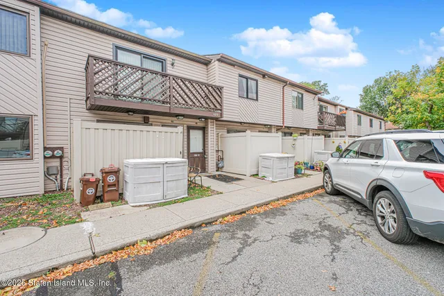 a view of a car park in front of house