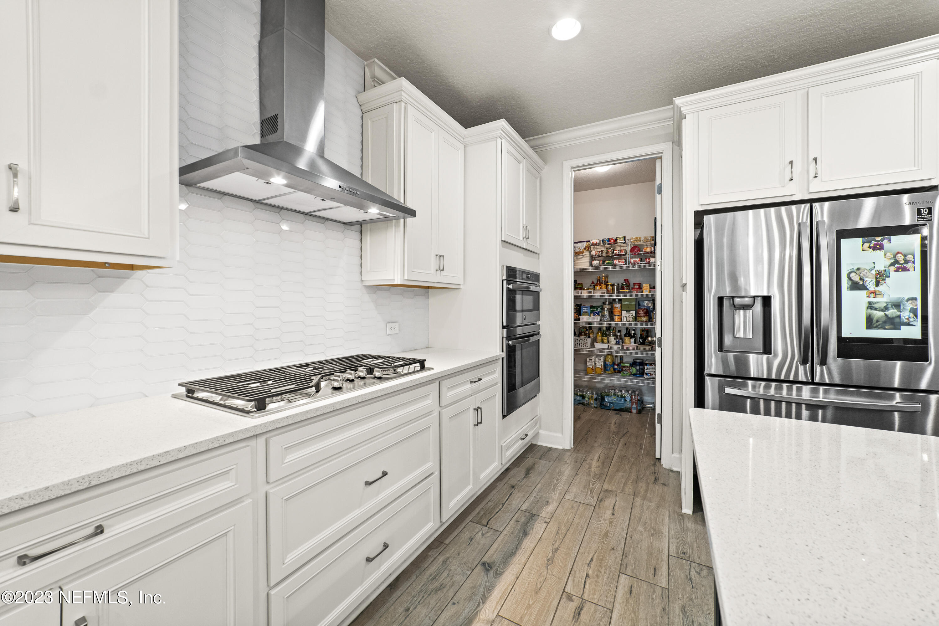 855 Flach Drive St. Johns, FL 32259 - Photo 11 of 50 a kitchen with stainless steel appliances granite countertop a stove and a refrigerator