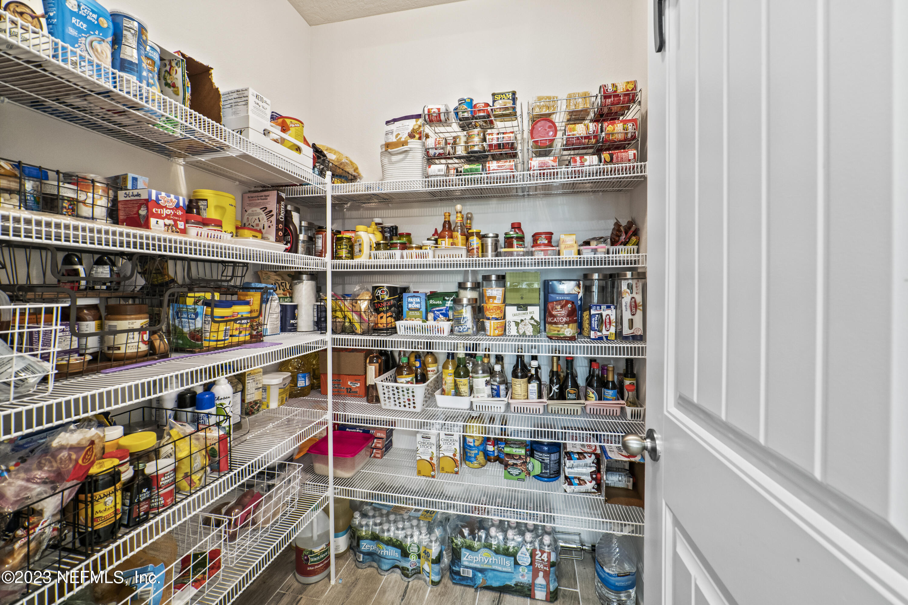 855 Flach Drive St. Johns, FL 32259 - Photo 14 of 50 a room with lots of bottles of alcohol