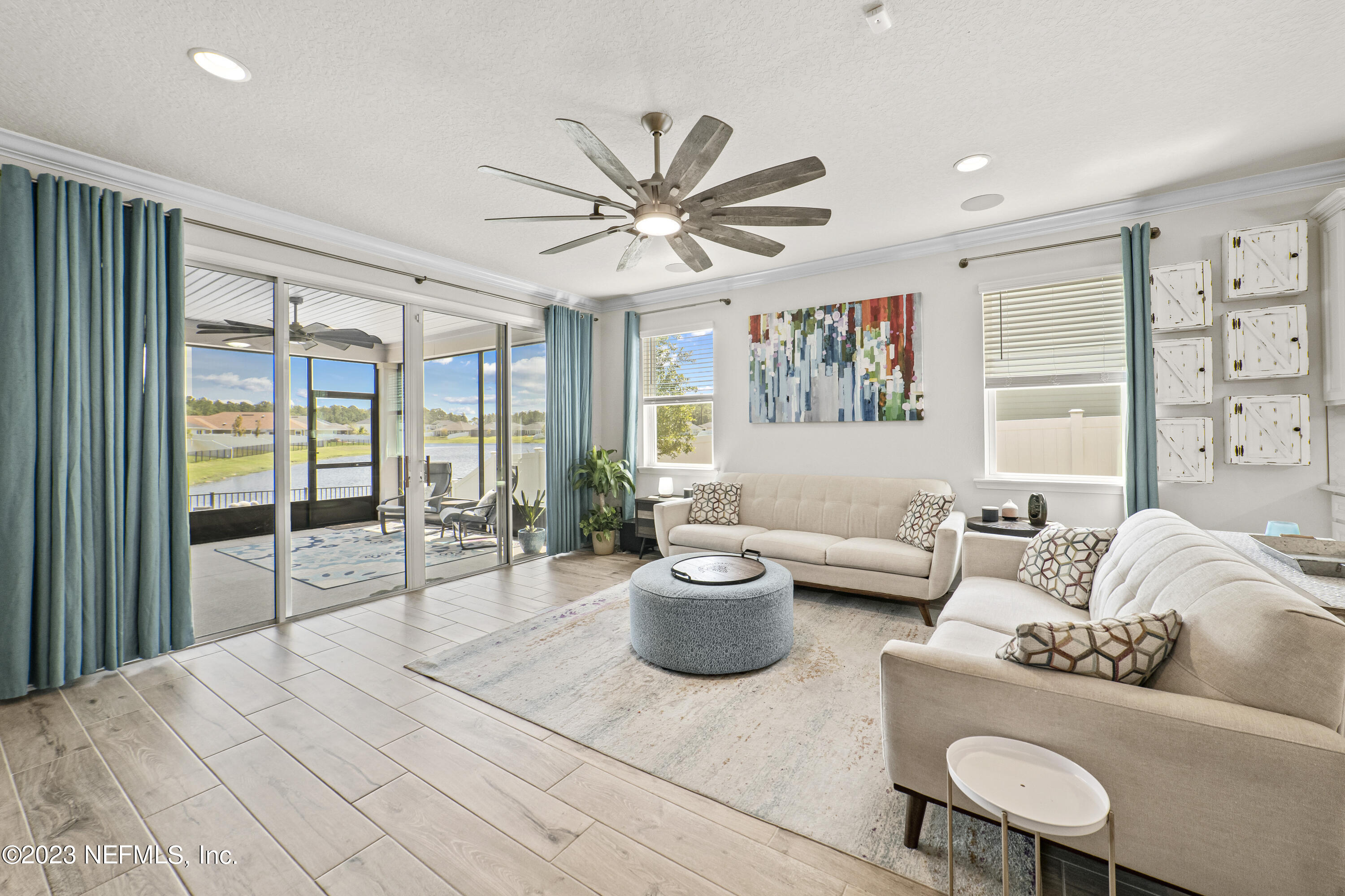 855 Flach Drive St. Johns, FL 32259 - Photo 16 of 50 a living room with furniture and a large window