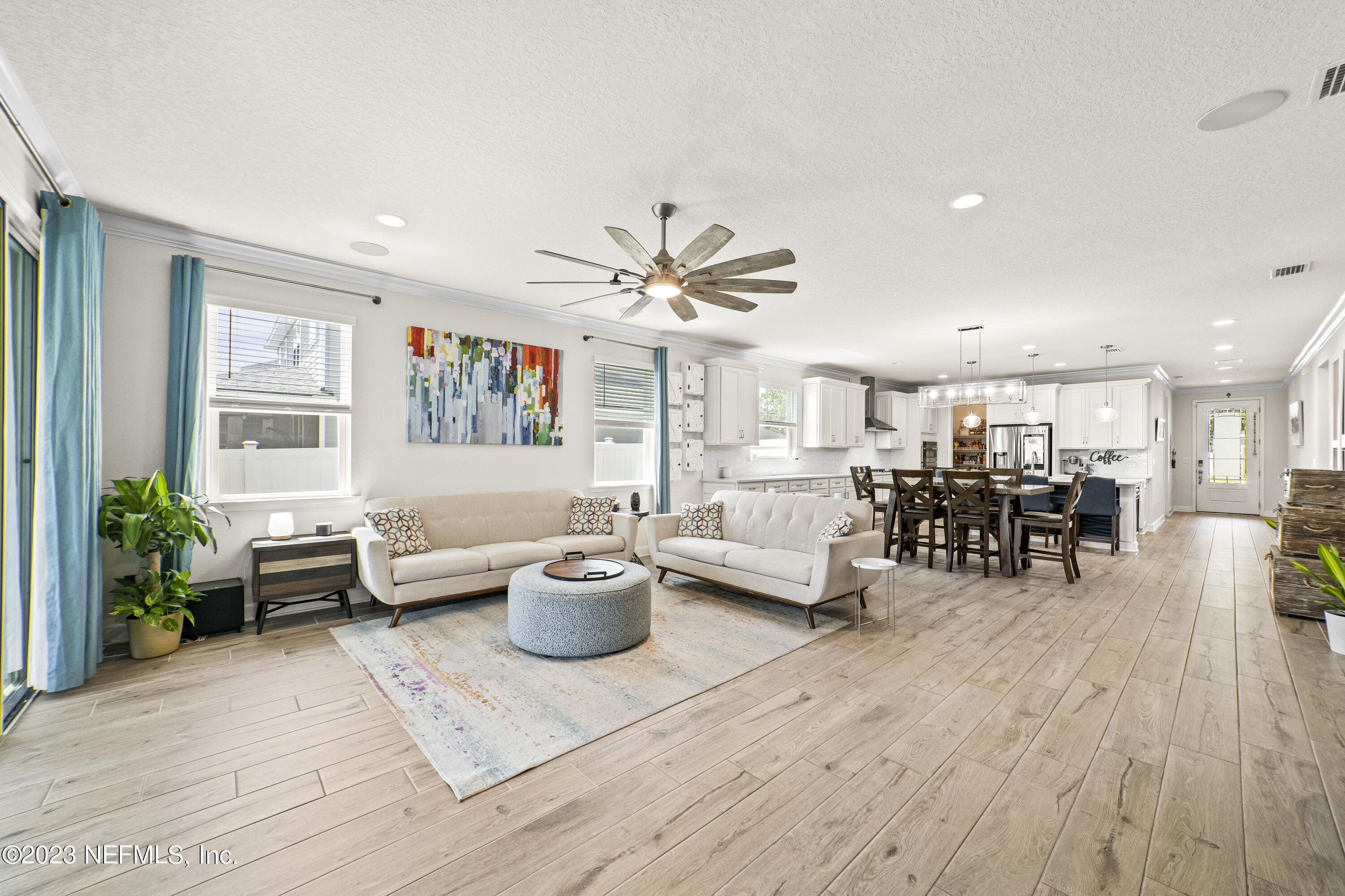 855 Flach Drive St. Johns, FL 32259 - Photo 17 of 50 a living room with furniture and wooden floor