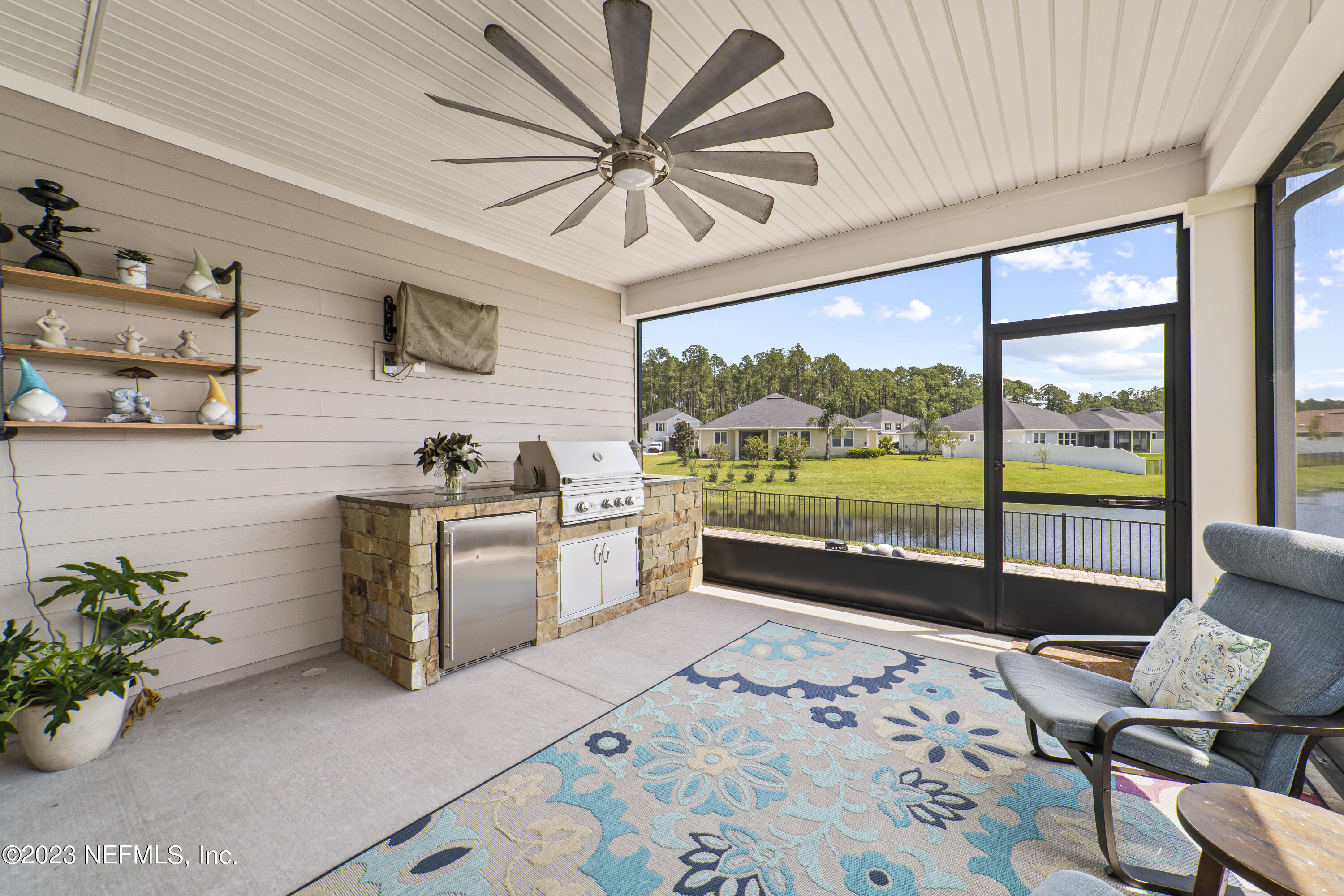 855 Flach Drive St. Johns, FL 32259 - Photo 20 of 50 a very nice looking living room with a large window a dining table and chairs