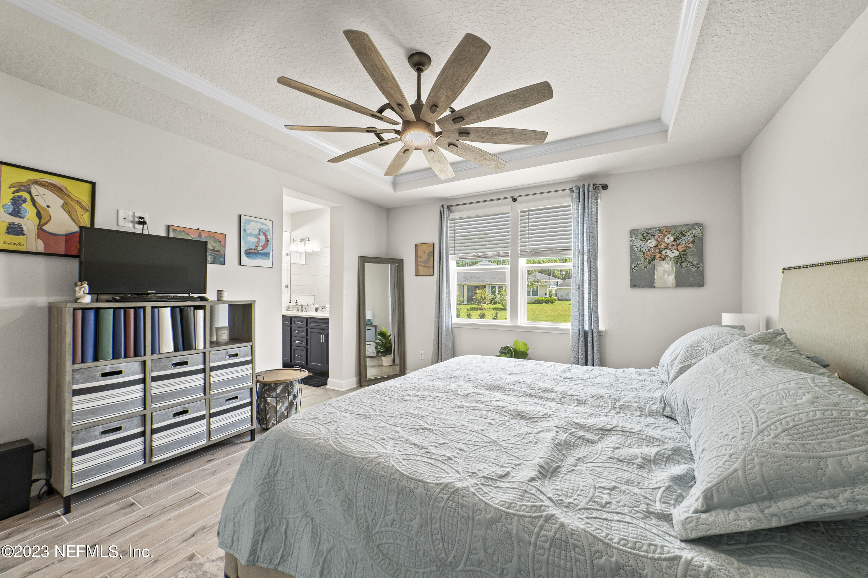 855 Flach Drive St. Johns, FL 32259 - Photo 24 of 50 a bedroom with a bed bookshelf and a window