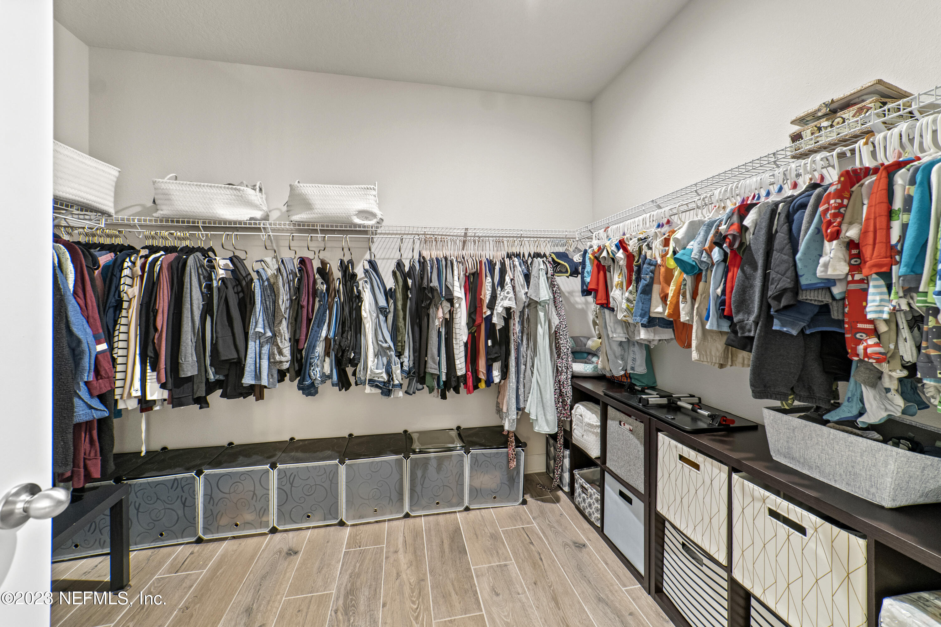 855 Flach Drive St. Johns, FL 32259 - Photo 31 of 50 a view of walk in closet with clothes and shoes