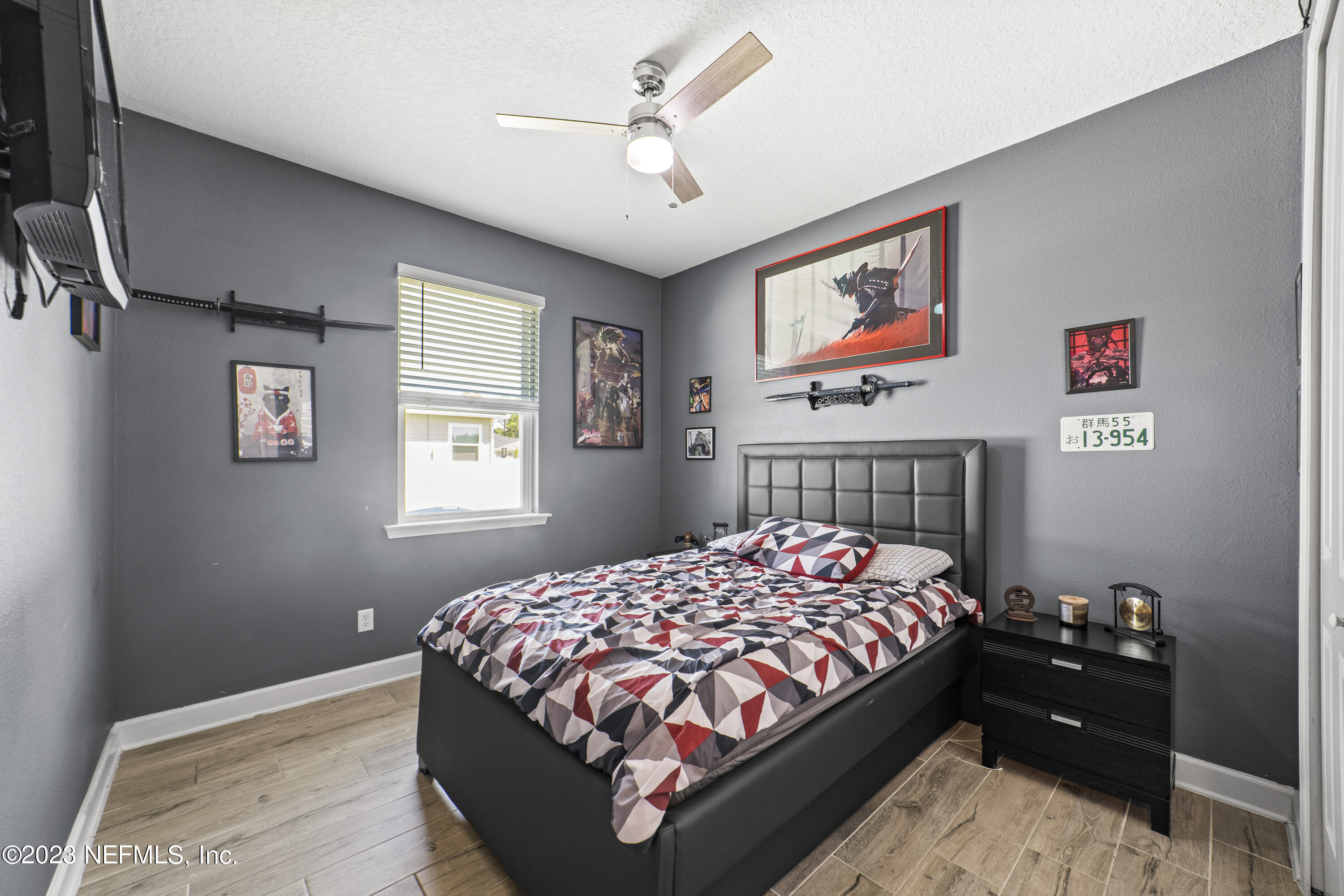 855 Flach Drive St. Johns, FL 32259 - Photo 36 of 50 a bed sitting in a bedroom next to a window