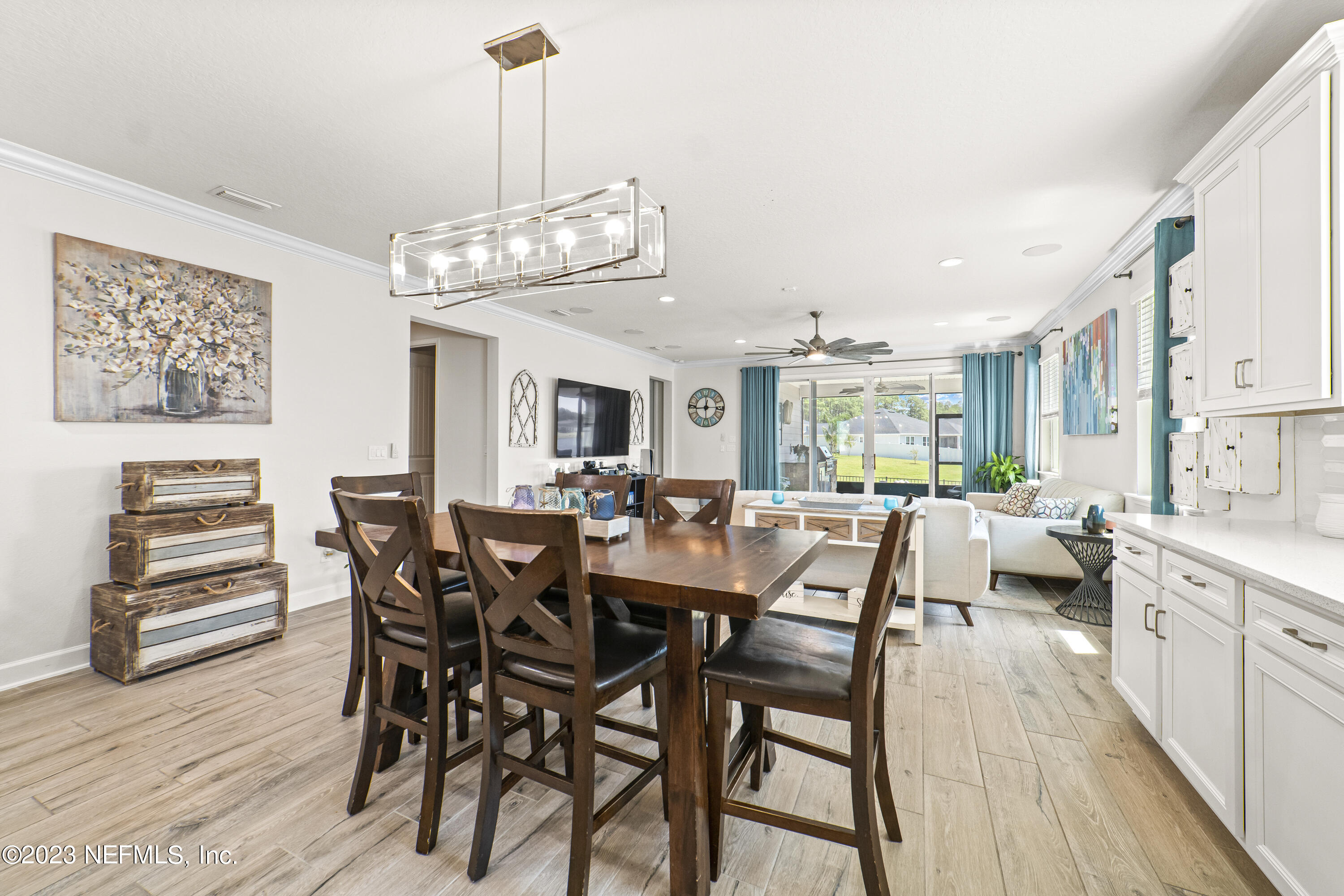 855 Flach Drive St. Johns, FL 32259 - Photo 4 of 50 a view of a dining room with furniture window and wooden floor
