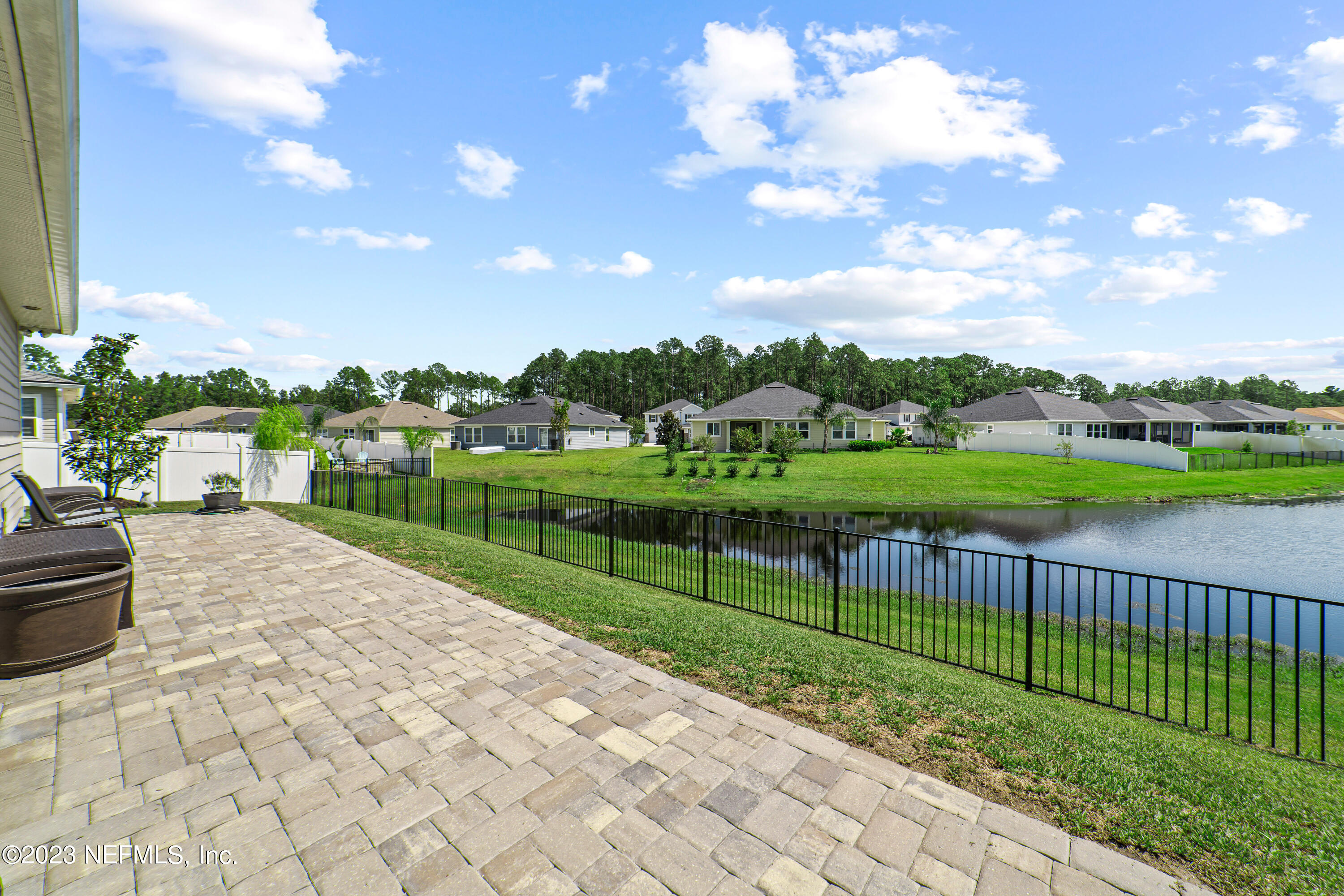 855 Flach Drive St. Johns, FL 32259 - Photo 45 of 50 a view of a pathway with a wrought fence