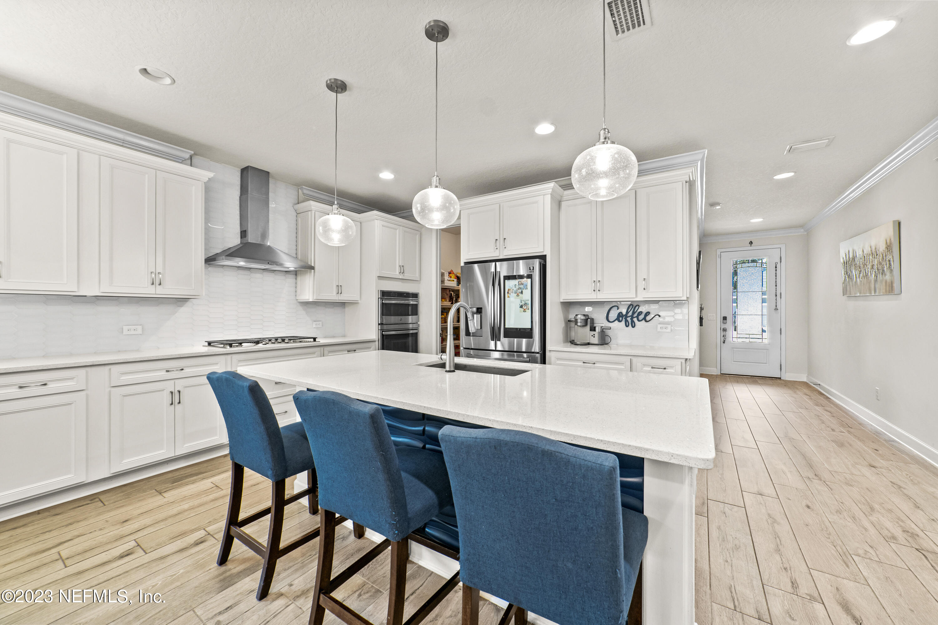 855 Flach Drive St. Johns, FL 32259 - Photo 7 of 50 a large kitchen with a table and chairs