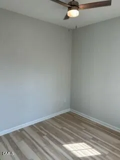 a view of a room with a empty space and a window