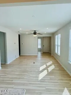 a view of a livingroom with wooden floor