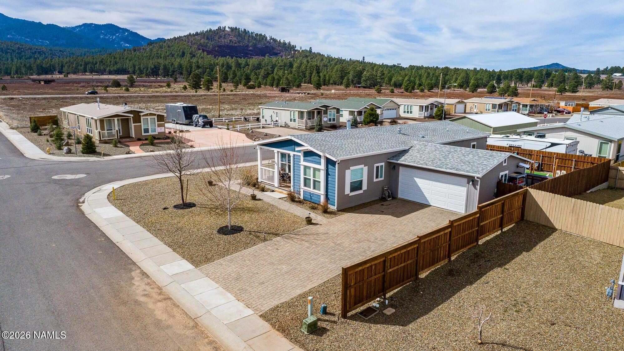 147 Pinecrest Trail Williams, AZ 86046 - Photo 2 of 39 a view of a house with a swimming pool and a yard