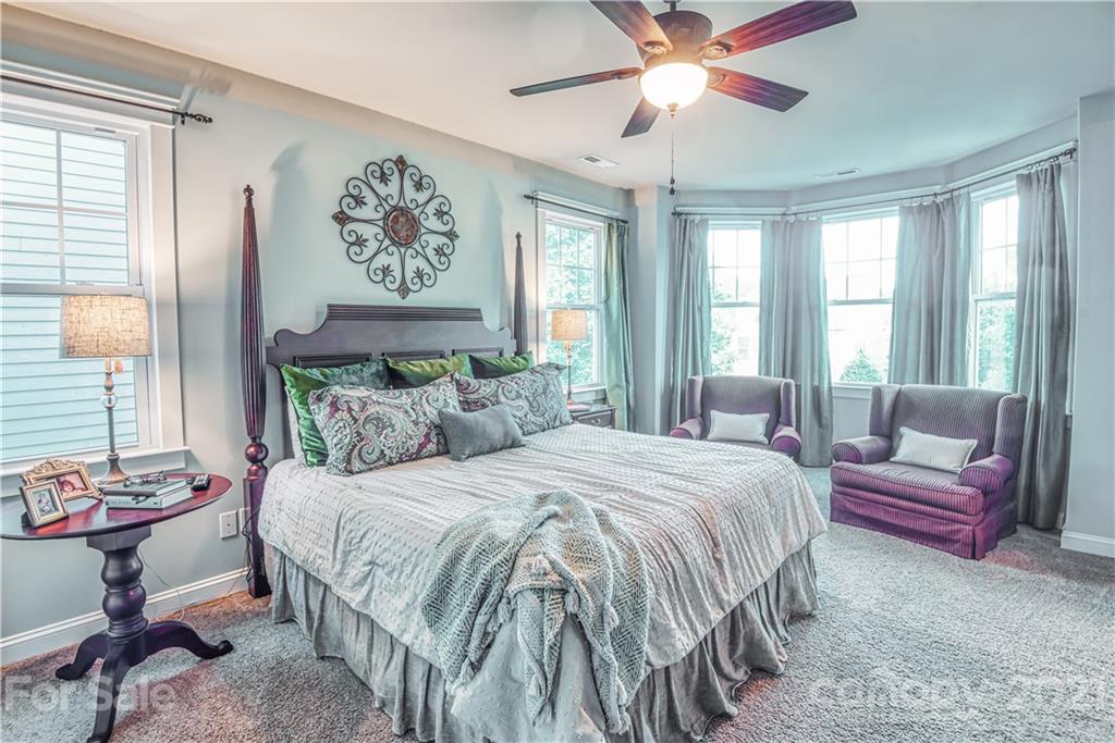 3547 Richard's Crossing Fort Mill, SC 29708 - Photo 17 of 41 a bedroom with a bed and a chandelier