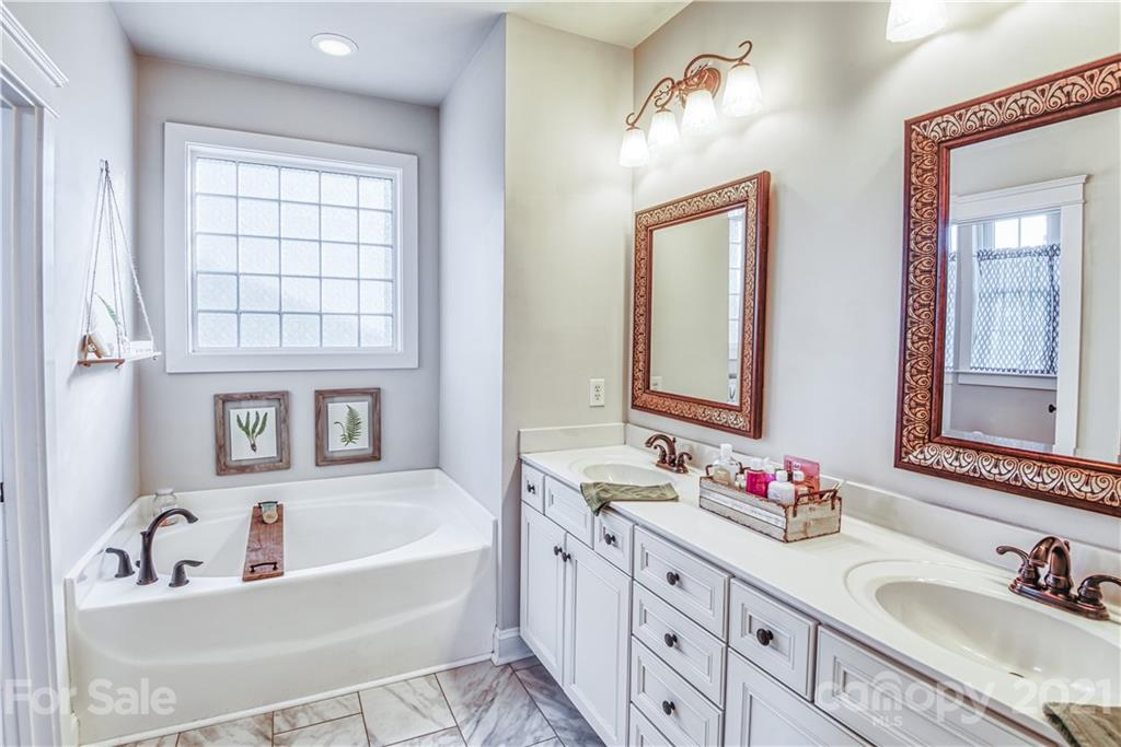 3547 Richard's Crossing Fort Mill, SC 29708 - Photo 18 of 41 a bathroom with a tub sink and mirror