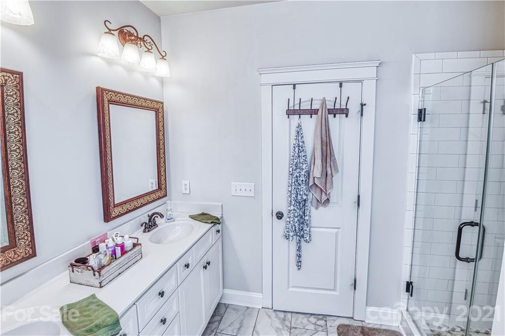 3547 Richard's Crossing Fort Mill, SC 29708 - Photo 20 of 41 a bathroom with a sink vanity and a mirror