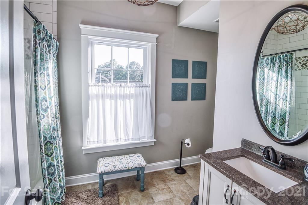 3547 Richard's Crossing Fort Mill, SC 29708 - Photo 23 of 41 a bathroom with a sink a mirror and a window