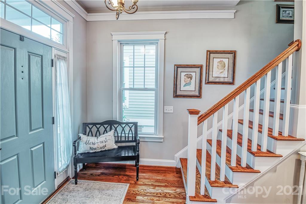 3547 Richard's Crossing Fort Mill, SC 29708 - Photo 4 of 41 a bedroom with stairs wooden floor and a window