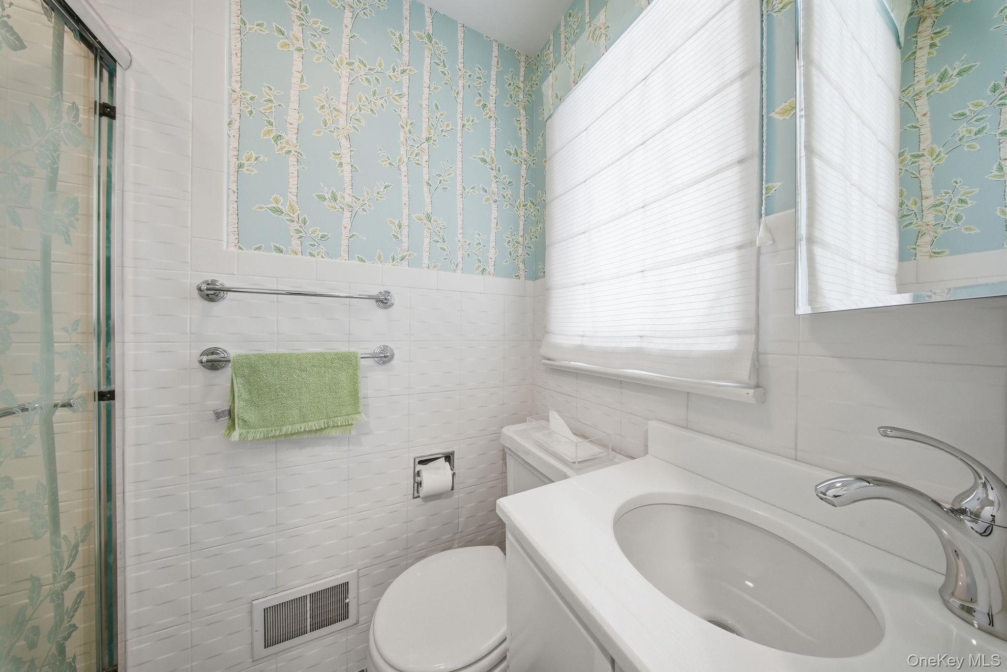 736 Highway 94 Warwick, NY 10921 - Photo 31 of 49 a bathroom with a sink a toilet and mirror